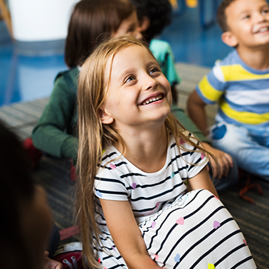 Little girl in classroom learning